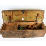 Pine oblong chest, containing various wooden planers, and a torch