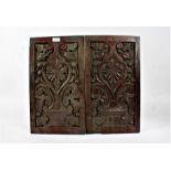 Pair of 19th century carved oak panels, carved in relief with leaves and scrolls, 46cm high x 26cm