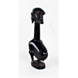 African tribal carved fertility figure, depicting a long necked pregnant figure, 38.5cm high