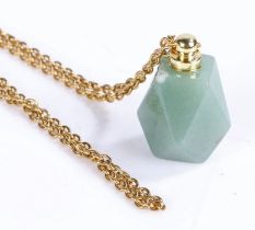 Jade pendant on a yellow metal chain