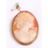 9 carat gold cameo brooch depicting a lady in a floral dress, 5cm long