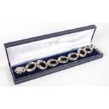 Silver bracelet formed from tapering oval links, 1.2oz