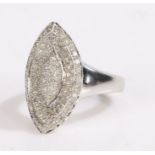 14 carat white gold diamond cluster ring, the pointed oval arched head with a raised centre all