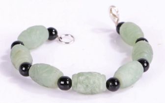 Carved Jade bracelet intersecting black stones, 20cm long