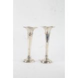 Pair of silver spill vases, Birmingham marks rubbed, with wavy rims above tapering stems and
