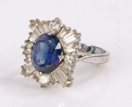 9 carat white gold ring, set with a faux sapphire and paste diamond effect surround, ring size K