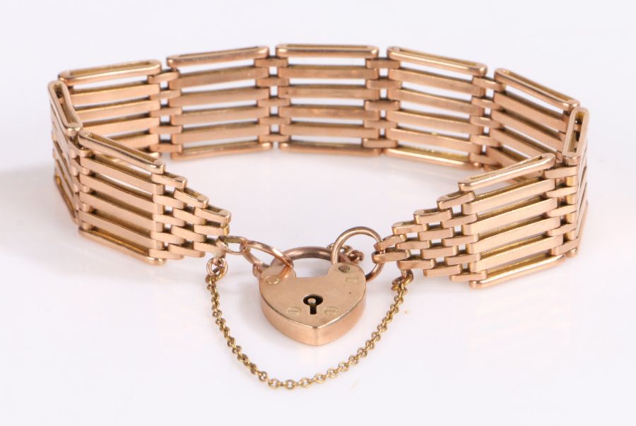 9 carat gold six bar gate bracelet, with padlock clasp and security chain, 24.9 grams