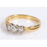 18 carat gold diamond set ring, with three round cut diamonds to the head, 3.7 grams, ring size O