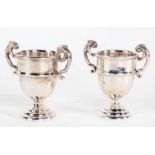 Near pair of George V silver trophy cups, Birmingham 1913 and 1916, makers marks rubbed, each with