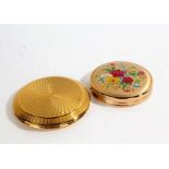 Two powder compacts one by Melissa decorated with a floral design (2)