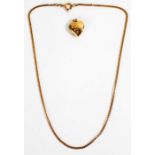 9 carat gold Heart shaped locket together with a 9 carat gold chain, gross weight 7.8 grams