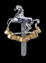 Scarce British army cap badge in anodised aluminium to the Kings Regiment, slider to the reverse