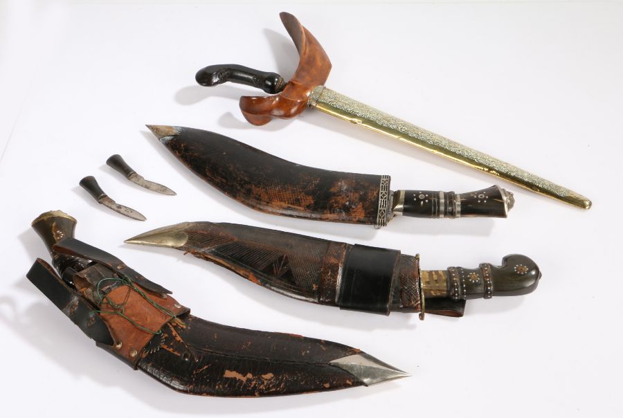 Two ornamental kukris and curved knife, all made in India, together with an ornamental Malaysian