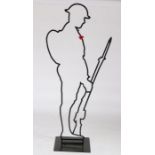 Memorial silhouette figure to a First World War 'Tommy' , black coated aluminium, with base,