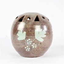 Studio pottery art vase, the top with cut out shapes above leaves and applied decoration, signed