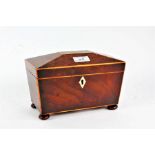 Regency mahogany sarcophagus shaped tea caddy, with boxwood inlay, the hinged lid enclosing a two