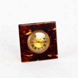 Early 20th century tortoiseshell easel clock, of square form, with gilded dial and black roman