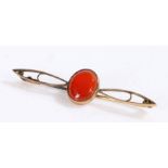 9 carat gold bar brooch with a oval stone, 5.5cm long gross weight 1.8 grams