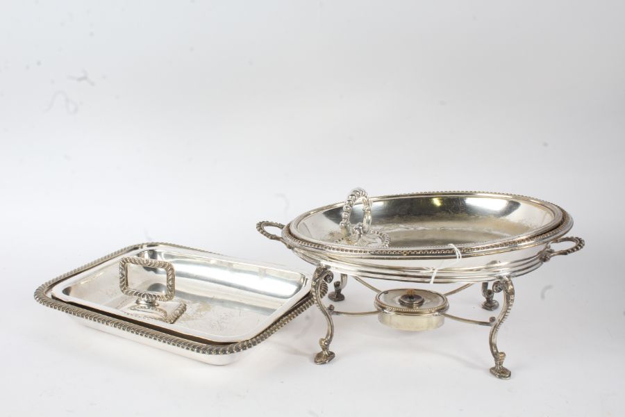 Silver plated chafing dish, of oval form, the lid with detachable handle and beaded rim, raised on a