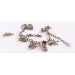 Silver charm bracelet with charms depicting mouse, swan and a rocking horse,18cm long gross weight