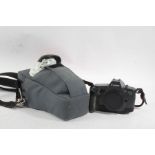 Canon EOS 600 camera body, with a Sppedlitw 300EZ flash gun, housed in canvas bag