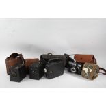 Collection of cameras, consisting of a Kodak Cine Eight Model 20, Kodak Six-20 Model 4, Junior,