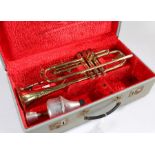 Cor Ton Brass Trumpet with fitted hard case and mute.