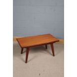 20th Century teak coffee table with a rectangular top raised on papering legs, 93cm long 45cm tall