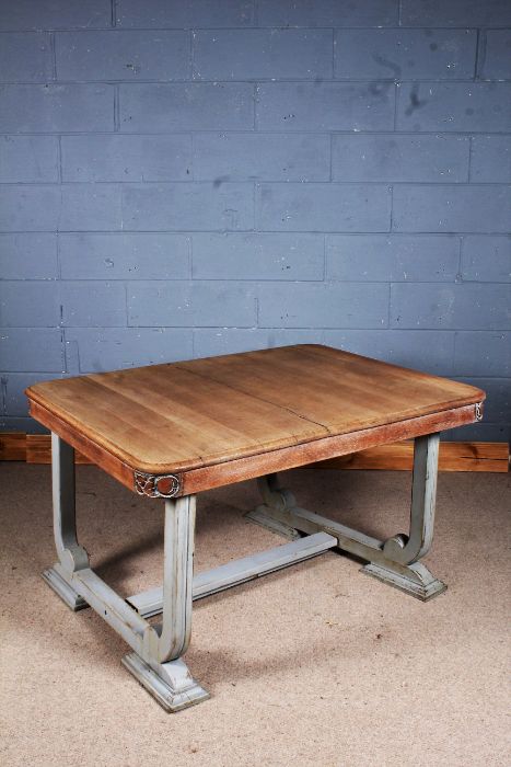 20th century painted limed oak dining table, with a floral design to the corners of the table top,