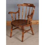 20th century Ibex style beech armchair, with spindle back rest, 81cm tall