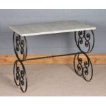 Edwardian marble washstand top, now supported on a scrolled wrought iron base, 90.5cm wide