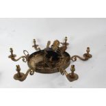 French regency style black patinated and gilt metal six branch light fitting, the scrolling branches