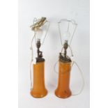 Pair of Chinese style converted table lamps, the burnt orange bodies tapering into a flared foot,