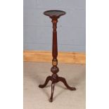Mahogany jardinière stand, the circular top raised on a reeded tapering column with central brass