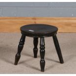 Small elm topped milking stool, raised on four legs, 25cm diameter