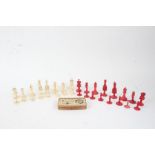 Late 19th Century stained ivory chess set, the king 7.5cm high, boxed set of draughts (qty)