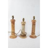 Pair of marble reeded column table lamps, each raised in circular feet, 30cm tall excluding fitting,