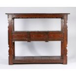17th Century style oak buffet, the rectangular top above a shaped frieze and middle tier