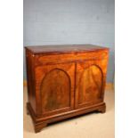 Victorian mahogany side cabinet, the frieze drawer above two arched panelled cupboard doors