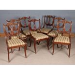 Seven Victorian style dining chairs, the shield shaped backs with central reeded cross-over