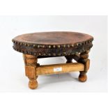 20th century oak and brown leather topped stool, of oval form, 39cm wide