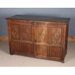 18th Century oak coffer now converted to a cupboard, the two diamond arched panelled doors opening