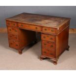 Victorian mahogany twin pedestal desk, with tooled brown leather inset top above three frieze