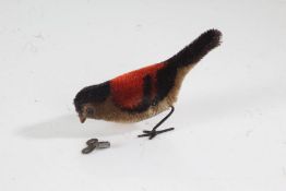 Early to mid 20th century wind up bird, in red and black, with key
