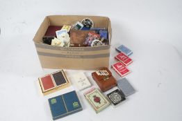 Large quantity of various games and puzzle, indoor boules, playing cards etc., housed in three boxes