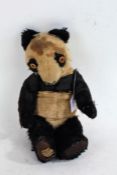 Mid 20th Century Merrythought panda, with label to foot, approx. 39cm tall