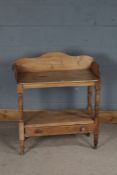 Victorian stripped pine washstand, having shaped gallery, under tier and fitted single drawer below,