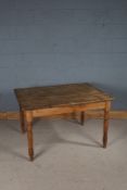 Stripped pine kitchen table, raised on tuned legs, 114cm wide, 87cm deep, 70cm high