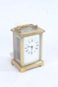 20th century brass cased carriage clock, the enamel dial with black roman numerals, with key, 11cm