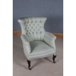 Edwardian elbow chair, the shaped button upholstered back and arms raised on cabriole legs and